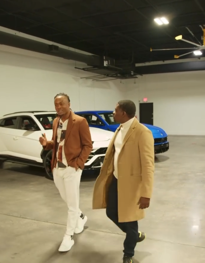 Pierre Laguerre in luxury car showroom discussing business partnerships